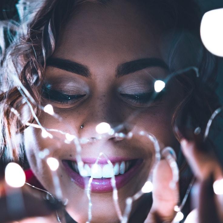 Ava Sharma, Lead Design Curator at True Field Anchor, reviewing corporate floral arrangements